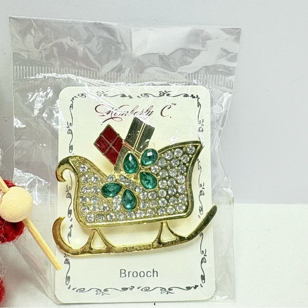 Cost Plus World Market Cranberry Balsam Candle sleigh pin and Santa ornament